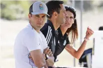  ?? GREGORY BULL/ASSOCIATED PRESS ?? From left, Landon Donovan looks on alongside assistant coaches Nate Miller and Carrie Taylor during a scrimmage Wednesday in Chula Vista, Calif. Donovan, one of the greatest U.S. soccer players of all time, has revived his passion for the game as coach of the expansion San Diego Loyal of the profession­al second-division United Soccer League.
SOCCER