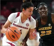  ?? NWA Democrat-Gazette/J.T. WAMPLER ?? Arkansas’ Jailyn Mason drives to the basket as Missouri’s Amber smith defends Monday at Bud Walton Arena in Fayettevil­le.