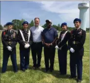  ?? RICHARD PAYERCHIN — THE MORNING JOURNAL ?? U.S. Army Gen. Johnnie Wilson, left, a Lorain native, third from right, poses for a photograph with members of the Lorain High School Army Junior ROTC Color Guard on June 3. From left are Matt Gannon, Sandro Marrero, adviser Dennis Owen, Alyssa Hall...