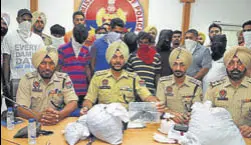  ?? PARDEEP PANDIT/HT ?? Accused in police custody along with seized drugs and pistol in Jalndhar on Wednesday.