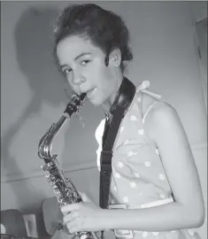  ??  ?? BLAST FROM THE PAST - 2010: Kelly Breen poses with a saxophone backstage at the musical ‘Torn Dreams’ in Rathnure Hall.