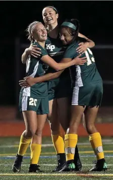  ?? MATT STONE / BOSTON HERALD ?? PLENTY TO CELEBRATE: King Philip's Jenna Hitchen, Avery Snead and Chloe Layne celebrate Avery's goal against Mansfield on Thursday.