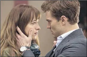  ?? UNIVERSAL PICTURES ?? In “Fifty Shades of Grey,” Dakota Johnson (left) and Jamie Dornan step into the roles of billionair­e entreprene­ur Christian Grey and college student Anastasia Steele.