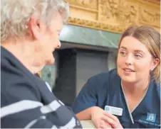  ?? ?? Robyn Oliphant working with Lisden resident Connie.