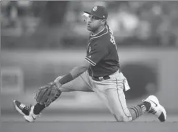  ?? ASSOCIATED PRESS FILE PHOTO ?? Yangervis Solarte holds on to the ball after catching a line drive in Los Angeles last Sept. 25. The Toronto Blue Jays acquired Solarte from the San Diego Padres on Saturday.