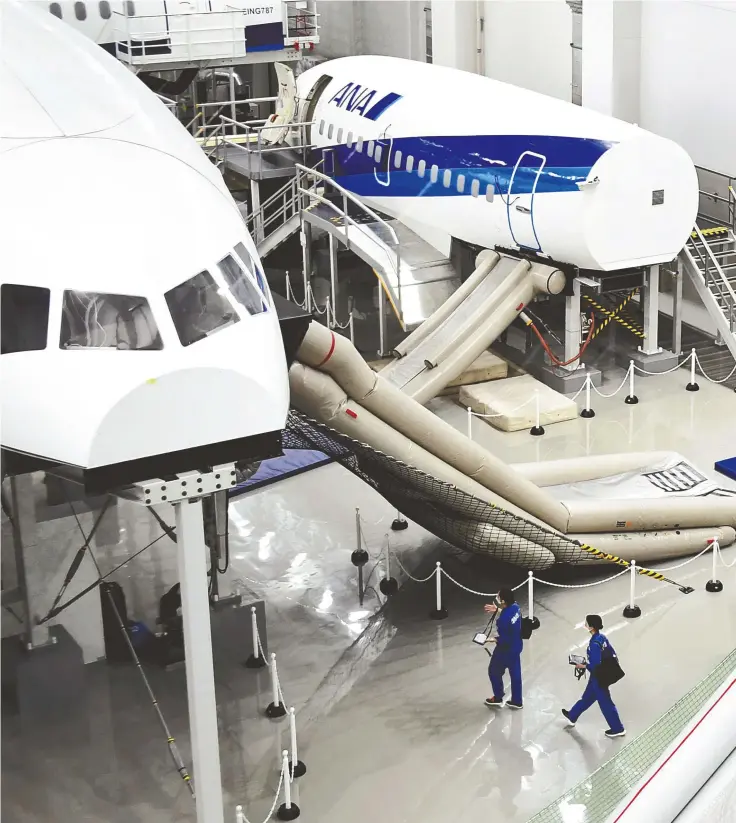  ?? ?? Various mock-ups of planes used for training are seen inside the ANA Blue Base in Ota Ward, Tokyo, on July 8.