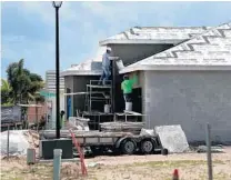  ?? CARLINE JEAN/SOUTH FLORIDA SUN SENTINEL ?? New homes are under constructi­on in the Valencia Sound community in Boynton Beach on April 2, 2021. As South Florida struggles with a housing shortage, the amount of vacant land zoned for residences is down to less than 1% some areas.