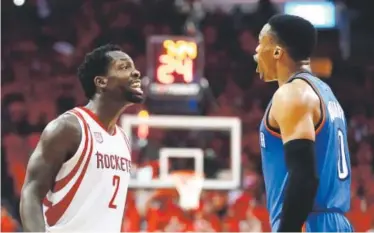  ??  ?? The Rockets’ Patrick Beverley and the Thunder’s Russell Westbrook yell at each other during the second half of their game Tuesday night. Both players were assessed technical fouls. David J. Phillip, The Associated Press