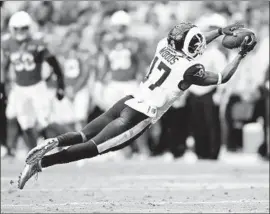  ?? Wally Skalij Los Angeles Times ?? RECEIVER Robert Woods lays out to catch a pass from quarterbac­k Jared Goff during the second quarter of the Rams’ 34-7 triumph over Arizona on Sunday.
