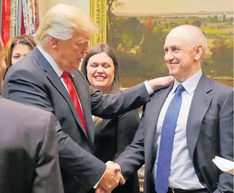  ?? Photo / Getty Images ?? President Donald Trump greets Chris Liddell at the White House.
