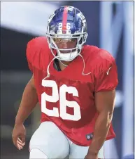  ?? Steven Senne / Associated Press ?? New York Giants running back Saquon Barkley steps on the field at the start of a joint practice with the New England Patriots on Thursday in Foxborough, Mass.