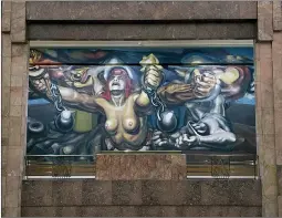  ?? ?? The Associated Press
“The new democracy” mural by Mexican artist David Alfaro Siqueiros is displayed in the Palacio Bellas Artes, in Mexico City.