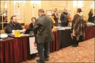  ?? LAUREN HALLIGAN - MEDIANEWS GROUP ?? Attendees speak with potential future employers during a Restaurant Industry Career Fair on Monday in Albany.
