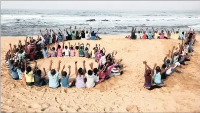  ?? PICTURE: SIBONELO NGCOBO ?? Children from The Mercury Hibberdene Children’s Home raise their hands in this 2014 file photo to celebrate Madiba’s legacy.