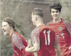  ?? ?? Bosham celebrate as Lewis Rustell (left) puts them 1-0 up | Chris Hatton