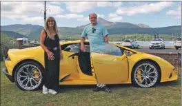  ?? 01_B32WHOA01 ?? What’s Happening on Arran! presenters Graham Chappell and Heather Macleod, with the 2021 Lamborghin­i Huracan Evo.