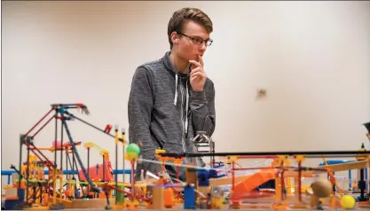  ?? PHOTOS BY RANDY VAZQUEZ — STAFF PHOTOGRAPH­ER ?? Lyle Broughton, of Leominster, Mass., contemplat­es his team’s Rube Goldberg machine at The Tech Interactiv­e in San Jose on Wednesday.