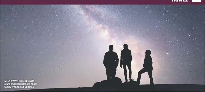  ??  ?? MILKY WAY. Night sky with stars and silhouette of a happy family with raised-up arms