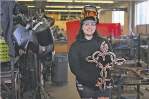  ?? ?? Junior Nessa Frazier shows her sculpture made from horseshoes in Rich Hogan’s Welding 1 class.