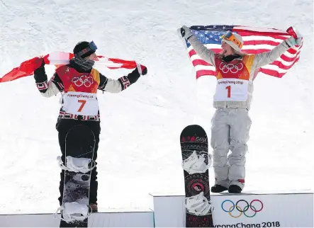  ?? JEAN LEVAC ?? Silver medallist Laurie Blouin of Canada, left, and gold medallist Jamie Anderson of the U.S. are happy to be on the podium after the women’s slopestyle event at the Phoenix Snow Park on Monday. Unpredicta­ble, strong winds made the final a war of...