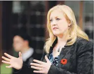  ??  ?? Transport Minister Lisa Raitt answers a question during Question Period in the House of Commons on Parliament Hill in Ottawa Wednesday.