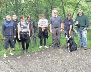  ??  ?? Clean-up squad Pause during work on Callander Crags