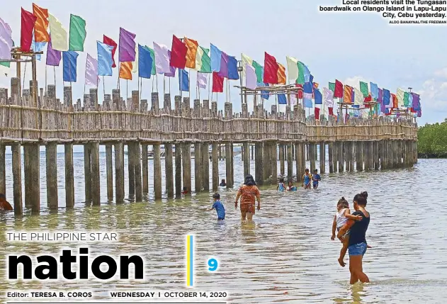  ?? ALDO BANAYNAL/THE FREEMAN ?? Local residents visit the Tungasan boardwalk on Olango Island in Lapu-Lapu City, Cebu yesterday.