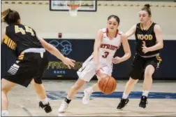  ?? JAMES BEAVER/FOR DIGITAL FIRST MEDIA ?? Germantown Academy’s Maddie Vizza (3) brings the ball down the court through Archbishop Wood defenders in a game at Jefferson University Sunday.