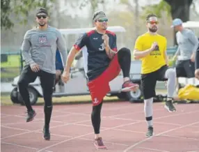  ?? Phelan M. Ebenhack, The Associated Press ?? From left, Carlos Gonzalez, Jose Lobaton and Ender Inciarte work out in Lake Buena Vista, Fla. CarGo is a former Rockies outfielder.