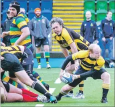  ??  ?? Lochaber scrum half Andy Milne spins the ball out to the backs.