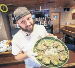  ?? JACOB LANGSTON/ORLANDO SENTINEL ?? Master oyster shucker Brian Clark won the U.S. National Championsh­ip last month in Maryland and is prepping for the next round in Ireland in 2019.