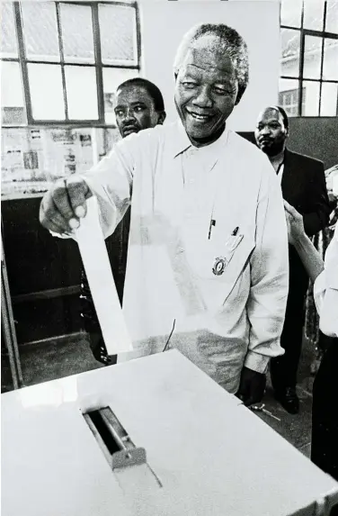  ?? Pictures: Paul Weinberg/Anzenberge­r ?? Nelson Mandela votes for the first time in his life at Ohlange High School, Inanda, KwaZulu-Natal.