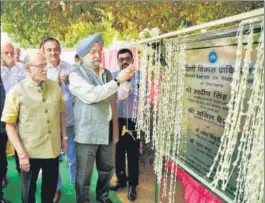  ?? AMAL KS/HT PHOTO ?? Union Minister Hardeep Singh Puri (right) along Lieutenant Governor of Delhi Anil Baijal during the foundation stone laying ceremony for several developmen­t projects by Delhi Developmen­t Authority, in Dwarka.