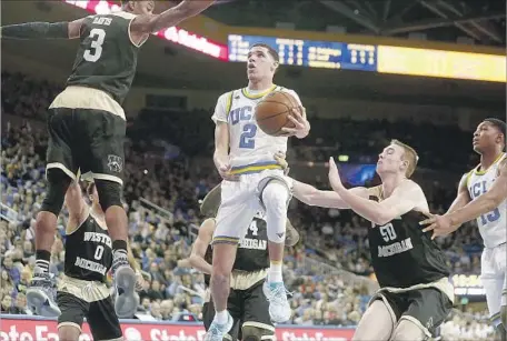  ?? Gary Coronado Los Angeles Times ?? UCLA GUARD Lonzo Ball is projected to be a top-two pick in the NBA draft and his father says he is already better than Stephen Curry.