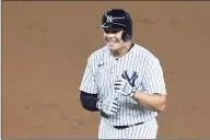  ?? Sarah Stier / Getty Images ?? Gio Urshela and the the Yankees are all smiles after clinching a playoff berth late Sunday following a Mariners loss to the Padres.