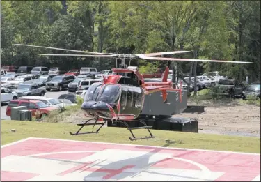  ?? The Sentinel-Record/Richard Rasmussen ?? TOUCHING DOWN: Pilot Mike Hambrecht lands the Bell 407 helicopter at National Park Medical Center that the hospital will use to provide additional emergency flight service in Hot Springs. NPMC partnered with Survival Flight Inc. to provide the service.