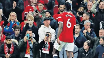  ?? ?? Walk of shame: Paul Pogba leaves the pitch after his red card at Old Trafford – but some fans asked for the Frenchman’s shirt