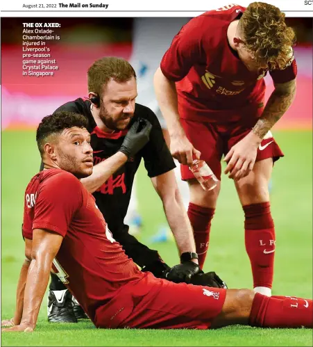  ?? ?? THE OX AXED: Alex OxladeCham­berlain is injured in Liverpool’s pre-season game against Crystal Palace in Singapore