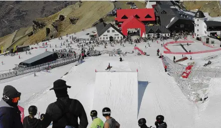  ?? PHOTO: ASPEN BRUCE ?? Leaping in . . . Looking down towards Cardrona base area, athletes from 18 countries watch as one athlete hits the Big Air jump.