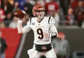  ?? Peter Joneleit / Associated Press ?? Cincinnati Bengals quarterbac­k Joe Burrow makes a pass attempt against the Tampa Bay Buccaneers Sunday in Tampa, Fla.