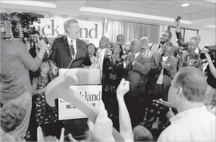  ?? PHOTOS BY STAN CARROLL/THE COMMERCIAL APPEAL ?? Jim Strickland reacts to cheers and chants from supporters at his campaign watch party. Strickland defeated incumbent Mayor A C Wharton and a field of challenger­s by a wide margin.