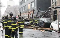  ?? KEVIN C. DOWNS/NEW YORK DAILY NEWS ?? Left: The New York City Fire Department responds to a report of a fallen scaffold and buried cars on Friday in Manhattan.