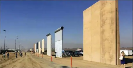  ?? ELLIOTT SPAGAT — THE ASSOCIATED PRESS FILE ?? This file photo shows prototypes of border walls in San Diego. President Donald Trump is heading to California on in his first visit to the state he loves to hate, since becoming president.