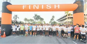  ??  ?? The runners in the 8km category waiting for the signal to start. — Photos by RaisSanusi