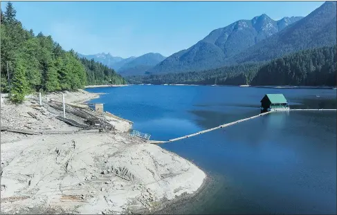  ?? JASON PAYNE/PNG FILES ?? Metro Vancouver reservoirs, including Capilano in North Vancouver, are at all-time lows for this time of year. As a result, a Stage 3 water restrictio­n has been put in place, including a ban on lawn sprinkling.