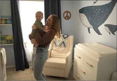  ?? PHOTOS BY HYOUNG CHANG — THE DENVER POST ?? Madalaine Heiser and her 17-month-old son, Brecken, play in their home in Aurora on Dec. 22.