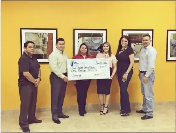  ?? PHOTO COURTESY OF ANITA M. MARTINEZ ?? First Imperial Credit Union donates $1,000 to the Sure Helpline Crisis Center.