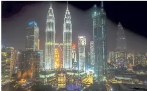  ??  ?? A magnificen­t night-view of the Petronas Twin Towers in the heart of Kuala Lumpur which is one of the top three most booked cities in Asia, according to travel booking portal Agoda.