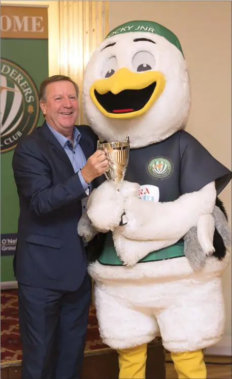  ??  ?? Ronnie Whelan presents the top mascot trophy to Rocky at the Bray Wanderers Awards Night at the Royal Hotel.