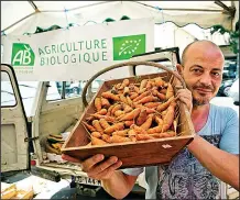  ?? Rick Steves’ Europe/DOMINIC ARIZONA BONUCCELLI ?? French market vendors take great pride in their produce, such as these organic carrots.